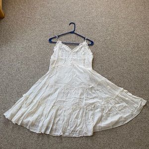 Ruffled White Dress with Button Detailing